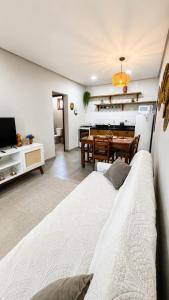 a living room with a couch and a table at Pousada Recanto do Luar in Serra de São Bento