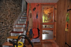 a room with a staircase and a wall with a door at Chambre d'hôtes Erziwezh in Sainte-Marie