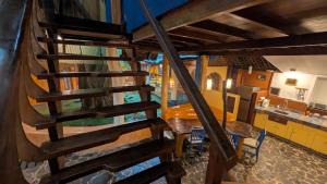 an overhead view of a kitchen and stairs in a house at Tree House Beachfront Lodge in Puerto Viejo