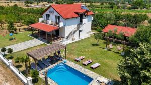 an aerial view of a house with a swimming pool at Guesthouse Micaj LUNI in Himare