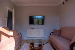 a living room with a couch and a coffee table at Golden Tree in Karaağaç