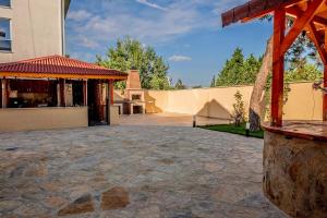 a building with a pavilion in the middle of a courtyard at Golden Tree in Karaağaç