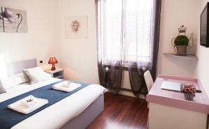 Postel nebo postele na pokoji v ubytování B&B Botton D'Oro 2
