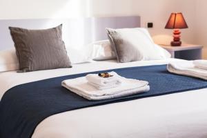 Postel nebo postele na pokoji v ubytování B&B Botton D'Oro 2