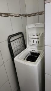 a washer and dryer in a small kitchen at Kelinda in Les Abymes +1 photo