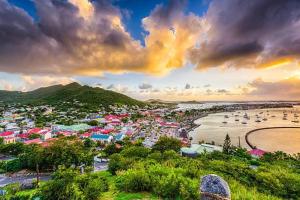 a view of a harbor with a beach and boats at U Are We R St Martin Studio Cosy Marigot, Wi-Fi ,Piscine in Marigot