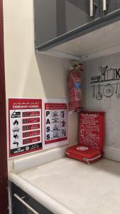 a refrigerator with signs on the side of it at غرفة وصالة دخول ذكي in Al Fayşalīyah