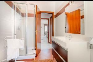 a bathroom with a sink and a mirror at Raggio Di Sole in Cosenza +17 photos