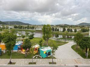 an aerial view of a park with trees and a river at Cozy Corner Beach Hotel in Phú Quốc