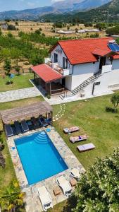 an aerial view of a villa with a swimming pool at Guesthouse Micaj LA KRIDEA in Himare