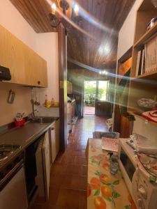 a kitchen with a counter top and a kitchen with at Montanara Home in Camigliatello Silano