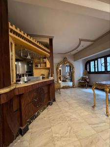 a large kitchen with a large island in a room at Kendaw home in Hihyā