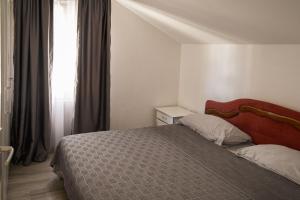 a bedroom with a bed and a window at Apartments Kuc in Tivat +67 photos