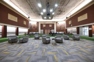 a large room with chairs and tables in a building at Urban Escape in Indianapolis