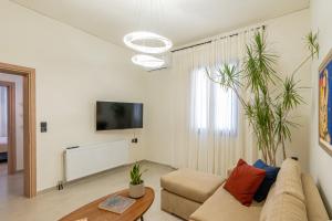a living room with a couch and a table at Art and Light in Argostoli