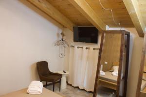 a room with a table and a chair and a television at Pupa1824 casedamare in Lentiscosa +48 photos