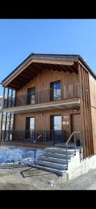 a large building with stairs in front of it at Casa Noemi in Livigno
