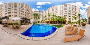 an image of a pool at a hotel with two tall buildings at Boulevard Park in Caldas Novas