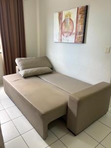 a bed sitting on a tiled floor in a room at Boulevard Park in Caldas Novas +15 photos