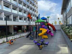 a playground with a slide in a building at Salinas Beach Resort in Salinópolis