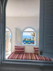 Giường trong phòng chung tại La Planque - Appart Hôtel - Vue sur mer