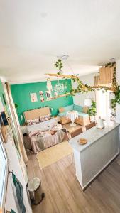 a living room with a bed and a couch at Rooftop Treehouse - Hammam Sousse in Sousse