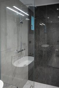 a shower with a glass door in a bathroom at Blue Horizon luxury residence in Kanali +31 photos