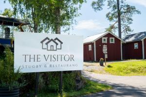 a sign for the visitor at a house at Visitor Stugby in Håverud +16 photos