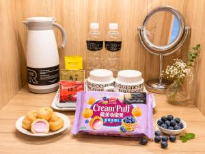 a table with a bag of cereal and some blueberries at Hotel Relax 5 in Taipei