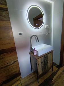 a bathroom with a sink and a mirror at Domček u Alberta in Vrbov +12 photos