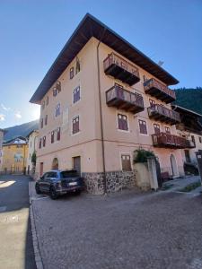 a building with a car parked in front of it at Casa Campani in Monclassico