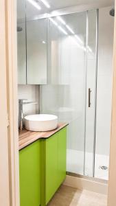 a bathroom with a sink and a glass shower at Le Balcon de Corrençon - Les Moucherolles in Corrençon-en-Vercors +22 photos