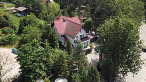 an aerial view of a house with a red roof at Ostrzyce Park in Ostrzyce +16 photos