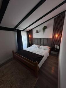 a bedroom with a large bed in a room at Casa del Mare in Vodice