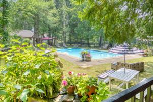 a view of a swimming pool with plants at The Inn at Stockbridge in Stockbridge