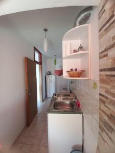 a kitchen with a sink and a counter at Apartment Maya in Banjole +30 photos