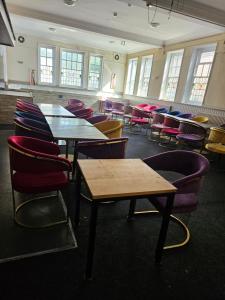 a room with tables and chairs in a classroom at Dudley Port in Ocker Hill