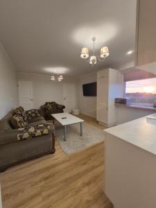a living room with a couch and a table at Boose Apart in Kobela