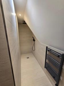 a stairway leading to a room with wooden floors at Ash Tree Hotel in Woolwich