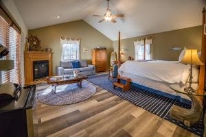 a bedroom with a bed and a living room at The Inn at Stockbridge in Stockbridge +116 photos