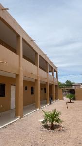 a large building with a plant in front of it at Departamento #1 in San Carlos