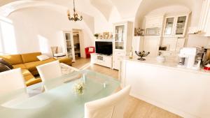 a kitchen and living room with a table and chairs at Haus Elsasser in Sankt Johann am Tauern