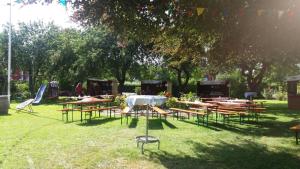 a group of tables and chairs in a park at Witt's Gasthof in Krummbek