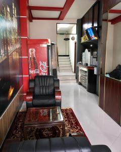 a living room with a couch and a coffee table at Hotel Beirut Oruro in Oruro