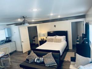 a bedroom with a bed and a couch at Serenity home in Laplace
