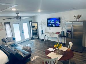 a living room with a couch and a table at Serenity home in Laplace