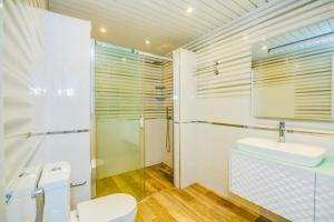 a bathroom with a toilet and a sink and a shower at 3 Bedrooms Apartment ın Center in Baku +15 photos