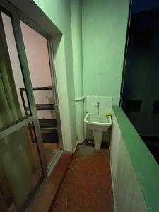 a bathroom with a toilet and a sink at Hostel Vergueiro in São Paulo +14 photos