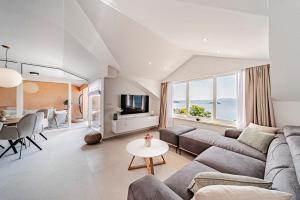 a living room with a couch and a table at Apartments Separovic in Prizba +151 photos