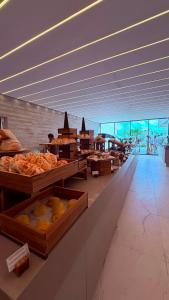a bakery with many different types of food on display at Salinas Beach Resort in Salinópolis